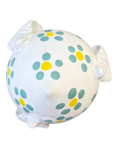 Pumo Poz Studio fiori verde Tiffany e firma Claudio Capozzi su sfondo trulli pugliesi al tramonto.