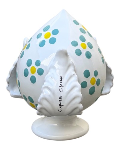 Pumo Poz Studio fiori verde Tiffany e firma Claudio Capozzi su sfondo trulli pugliesi al tramonto.